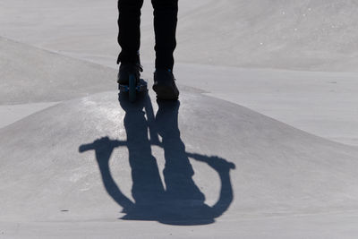 Low section of man on push scooter