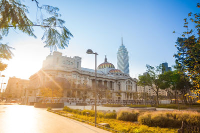 Buildings in city against clear sky