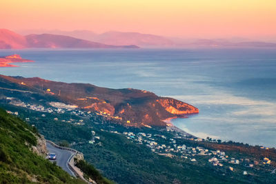 High angle view of sea against sky during sunset