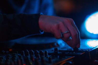 Close-up of hands playing guitar