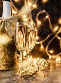 Close-up of wine glasses on table