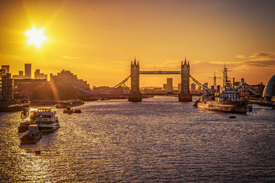 View of bridge over river during sunset