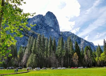 Scenic view of mountains against cloudy sky