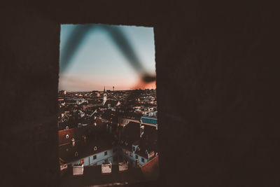 Cityscape against sky seen through window