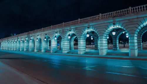 Illuminated street at night