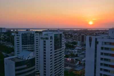 High angle view of buildings against sky during sunset