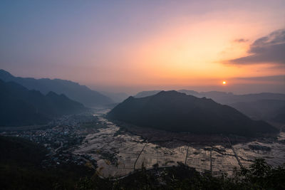 Scenic view of mountains against sky during sunset
