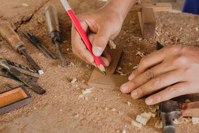 Cropped hands of man working at workshop