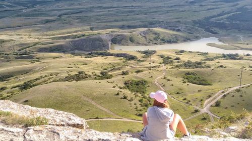 Rear view of woman standing on mountain