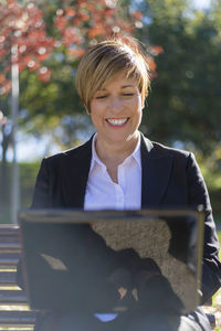 Portrait of businessman using laptop