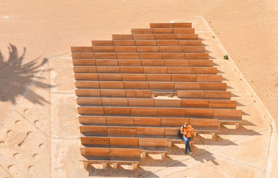 Low angle view of woman standing on staircase