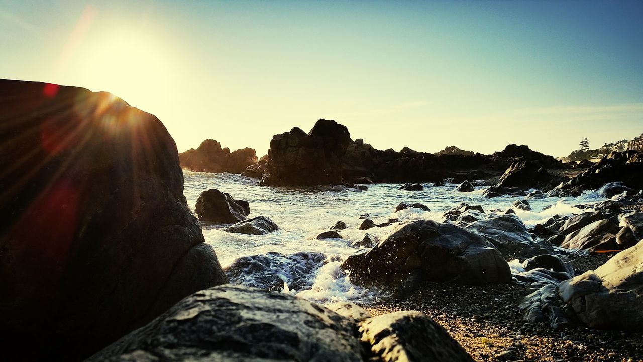 sun, rock - object, sunlight, sunbeam, scenics, tranquil scene, tranquility, snow, beauty in nature, lens flare, clear sky, winter, nature, rock formation, cold temperature, mountain, sky, non-urban scene, idyllic, sunset