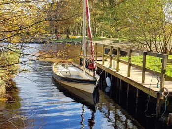 Boats moored in river