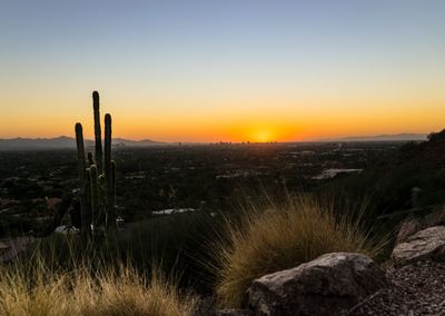 Scenic view of landscape against sky during sunset