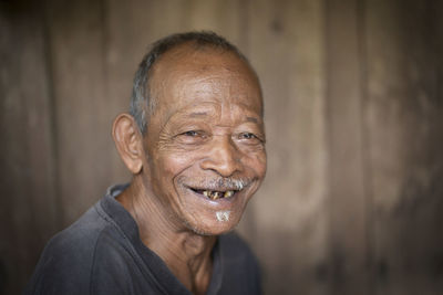 Portrait of an old man with vignette effect. blurred background