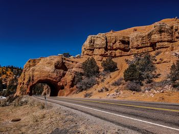 Scenic view of rock formation against clear blue sky