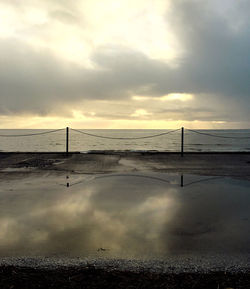 Scenic view of sea against cloudy sky