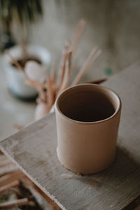 High angle view of coffee cup on table