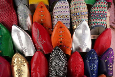 Close-up of multi colored shoes displayed for sale
