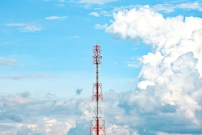 Low angle view of communications tower against sky