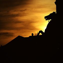 Silhouette of building at sunset