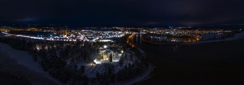 High angle view of illuminated buildings in city at night