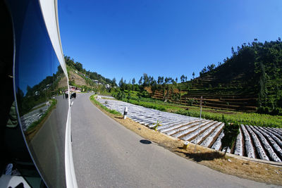 Panoramic view of road against clear blue sky