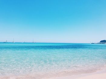 View of blue sea against clear sky