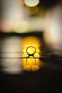 Close-up of yellow water on table
