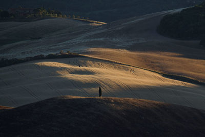 High angle view of person on landscape against sky tuscany val d orcia