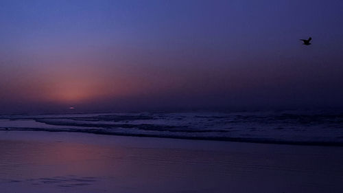 Scenic view of sea against sky at sunset