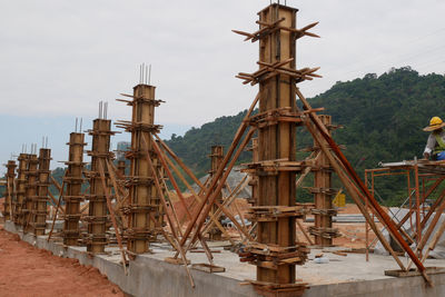 Traditional windmill on field against sky