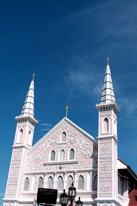 Low angle view of building against blue sky