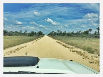 Road passing through field