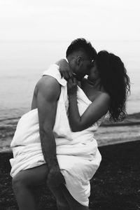 Couple kissing on beach