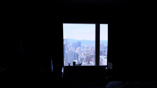 View of cityscape through window