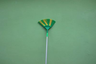 High angle view of multi colored umbrella on green table