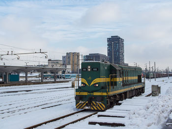 Train on railroad tracks during winter