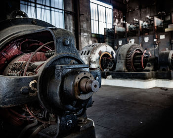 Close-up of rusty machine part in factory