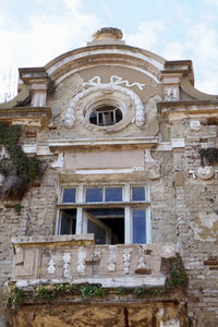 Low angle view of old building against sky