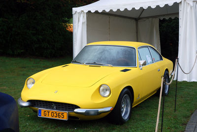 Yellow car parked in city