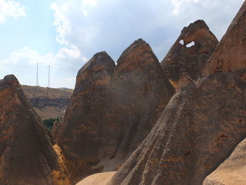 Panoramic view of rocky mountains against sky