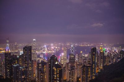 Aerial view of city lit up at night