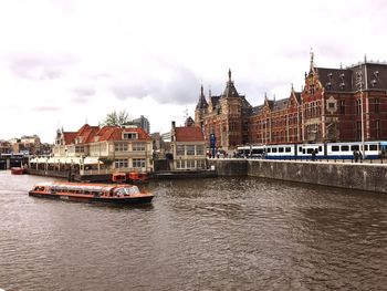 Cruise ship on canal in amsterdam