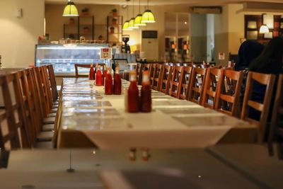 Empty chairs and tables in restaurant