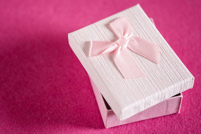 High angle view of pencil on table against pink background