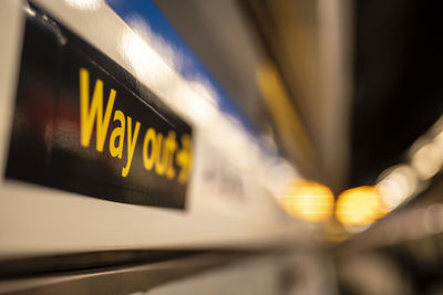 Close-up of yellow text on illuminated car