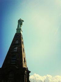 Low angle view of built structure against blue sky