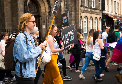 People standing on street in city