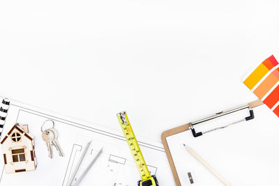 Low angle view of crane against white background